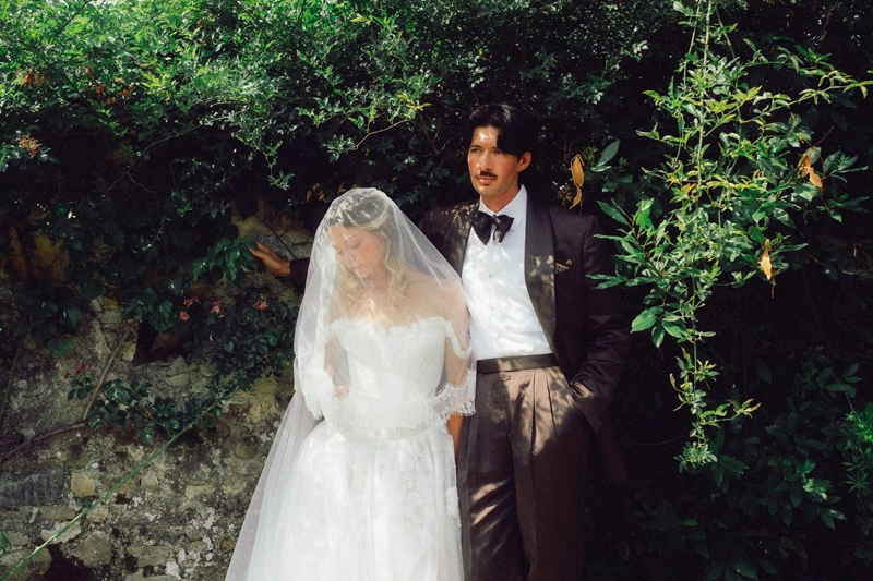wedding photo with couple on a lawn 