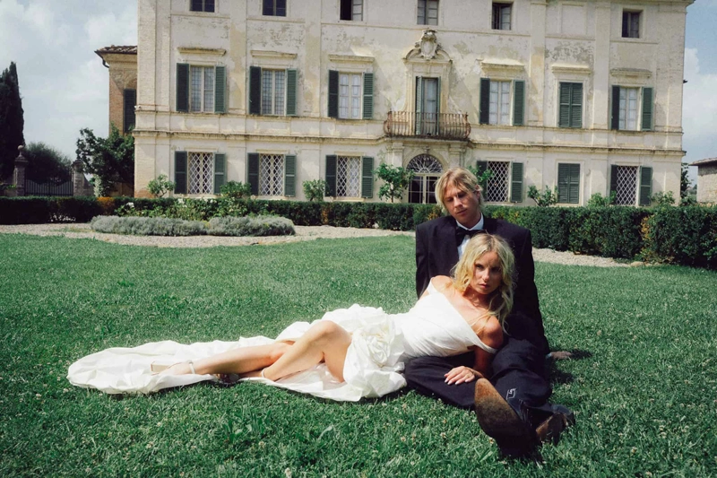 wedding photo with couple on a lawn 
