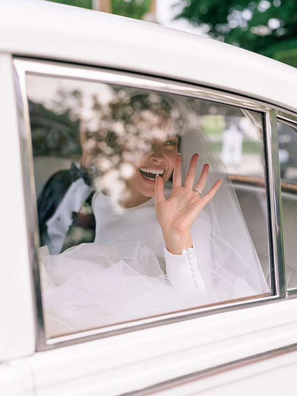 wedding photo with bride in car 