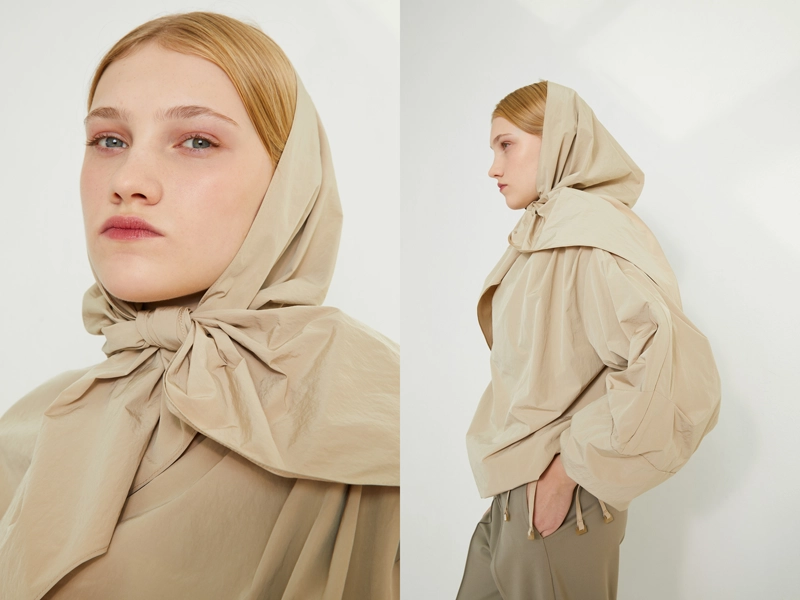 Retouching studio photographs of a fashionable French brand for catalogs for Paris Fashion Week. Portrait of a woman in a studio setting.