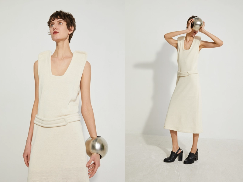 Retouched studio photos of the French fashion brand Veronique Leroy for their website for Paris Fashion Week. A portrait of a woman in a studio setting, wearing a fashionable white dress, against a white background.